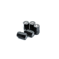 Pack of five black Blackhorn valve stem caps on white background.