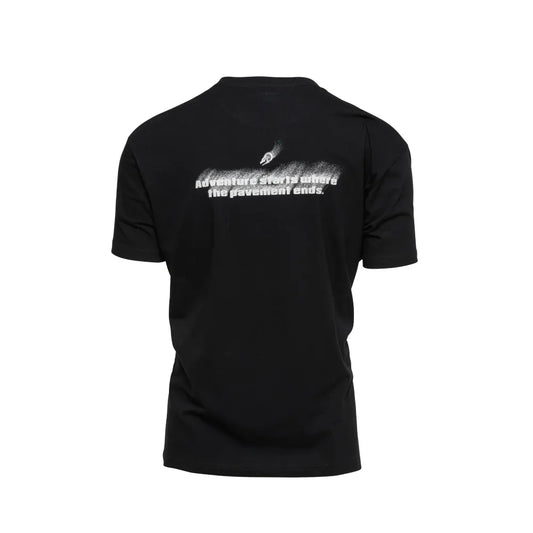 Back of Black Pavement Ends T-Shirt showing full spray-fade graphic and off-road adventure message.