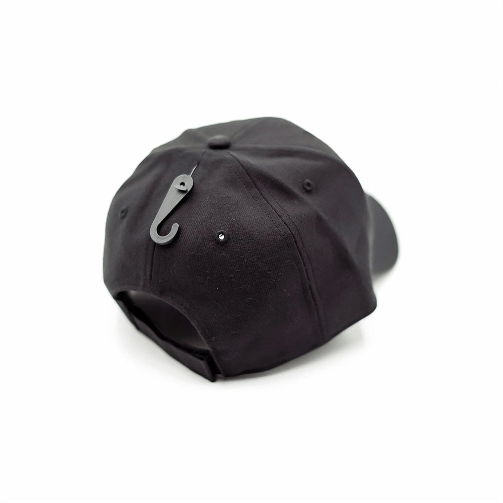 Rear view of the Blackhorn MVP Hat showcasing the black hook-and-loop (Velcro) closure and attached gear hook accessory, set against a clean white background.