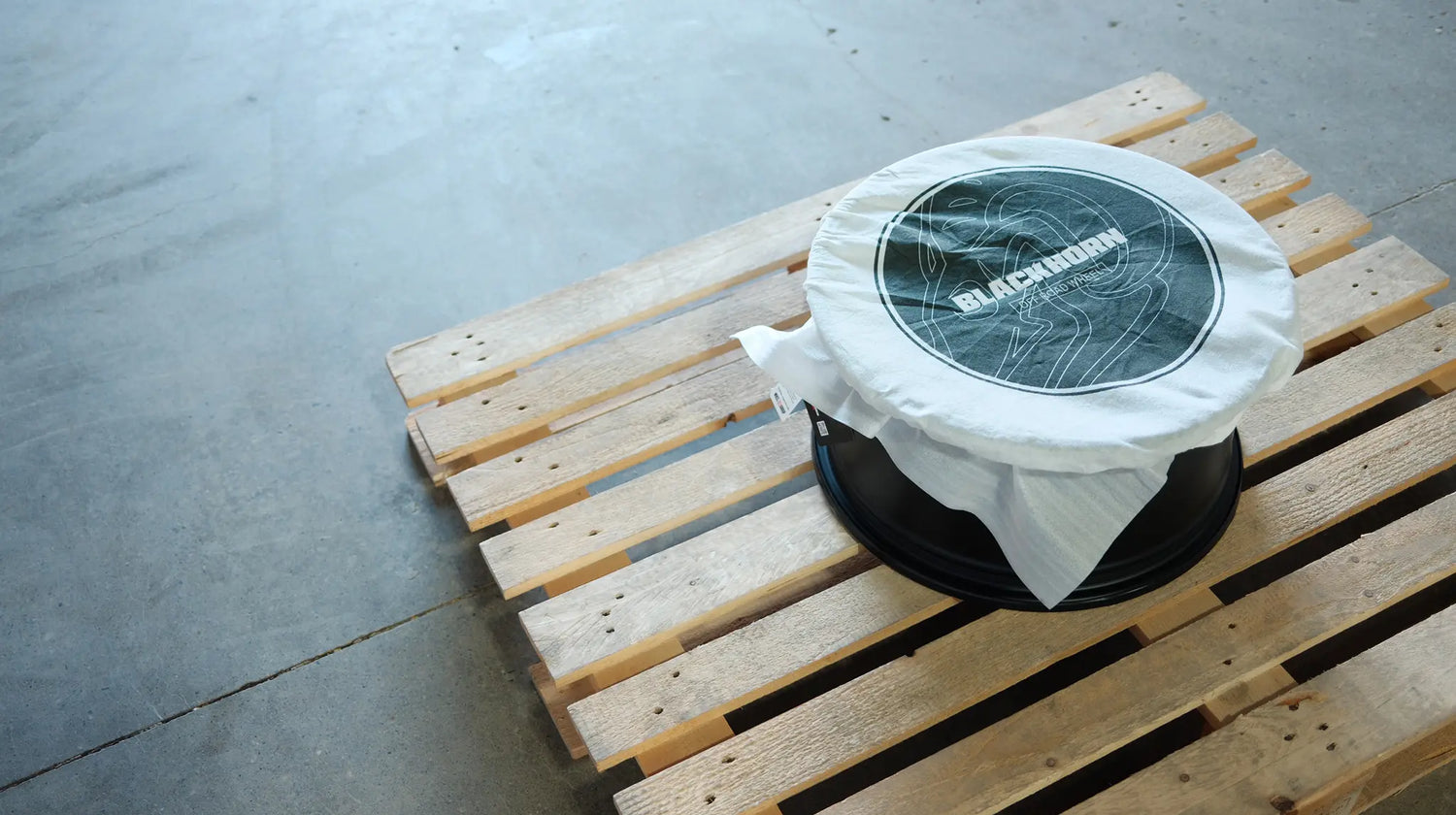New Blackhorn Offroad wheel freshly unpacked, sitting on a pallet in warehouse setting