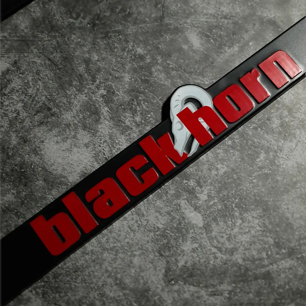 Detail view of Blackhorn Offroad license plate frame with embossed Blackhorn lettering and Skull logo.