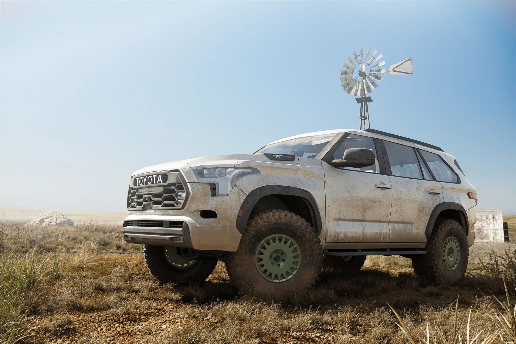 Blackhorn Offroad GR17 Ranger Green with BFGoodrich KM3 on Toyota 3rd Gen Sequoia in front an Old Windmill on a Farm