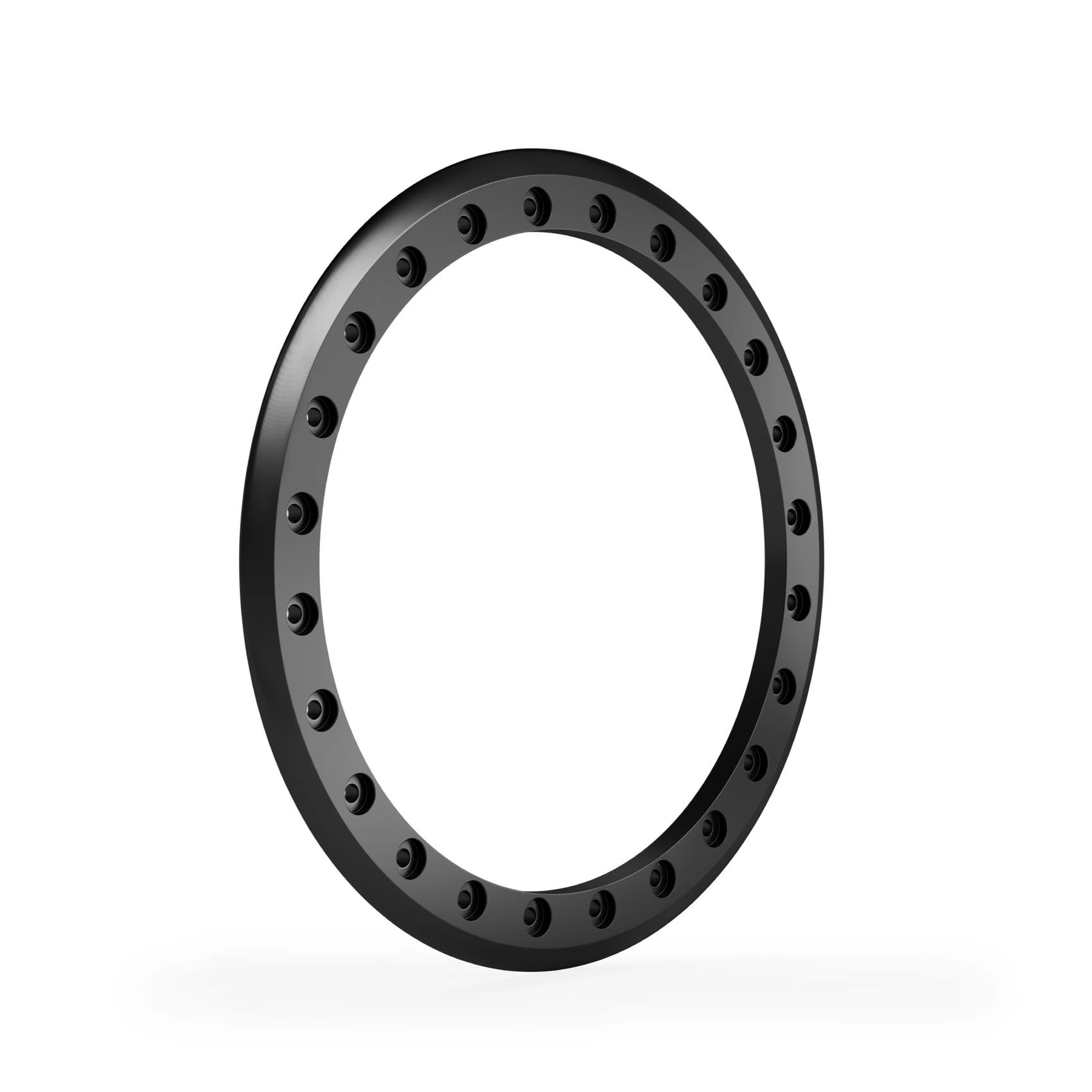 Corner angle black anodized beadlock ring highlighting machined detail and recessed bolt pockets.