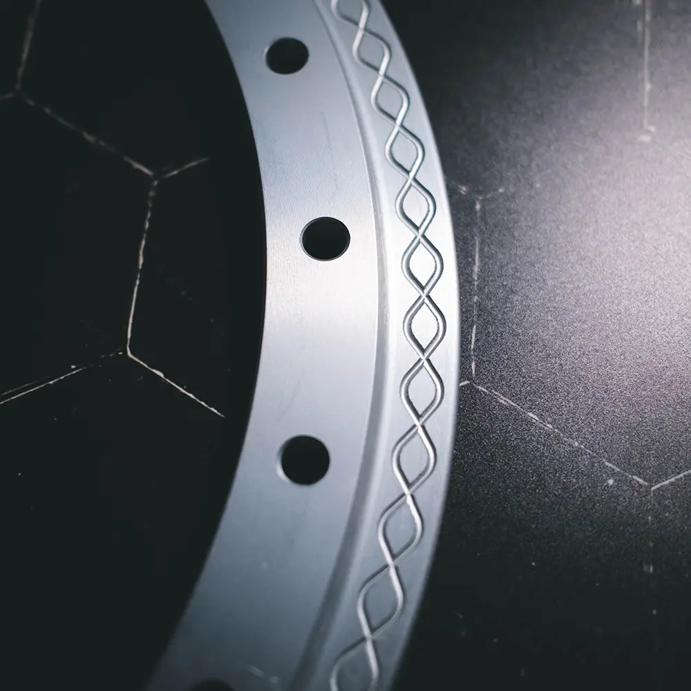 Close-up of Type 01 beadlock ring in anodized finish showing clean solid edge and knurled fishtail clamp surface detail